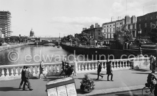 The River Liffey. View from O\'Connell Bridge: Butt Bridge, the Loop Line railroad Bridge above and just behind it, the Custom House in the background and the Liberty Hall skyscraper. Dublin 1963. - Photo by Edward Quinn