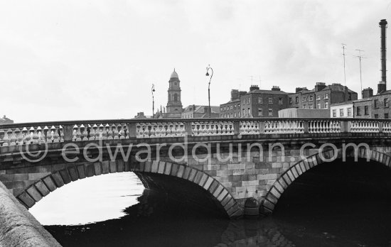 The River Liffey, Arran Quay. Father Mathew Bridge, St Paul\'s Church on the other side. Dublin 1963. - Photo by Edward Quinn