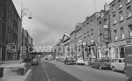 Westland Row with St Andrew’s Church. James Joyce wrote about the church as All Hallows in Ulysses, after the ancient Priory on whose lands it is built. Dublin 1963. - Photo by Edward Quinn