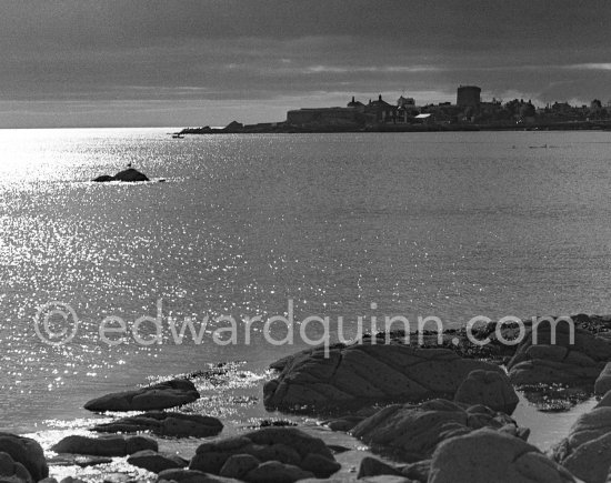 The sea near Dun Laoghaire (Kingstown) with the Sandycove Martello Tower in the distance. Dublin 1963. - Photo by Edward Quinn