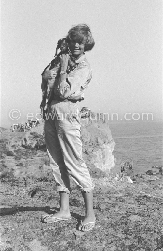 English actress Dawn Addams with a little goat during filming of L’Île du bout du monde. She continued her career despite her marriage in 1954. to Italian nobleman Don Vittorio Emanuele Massimo, Prince of Roccasecca. Saint-Jean-Cap-Ferrat 1958. - Photo by Edward Quinn