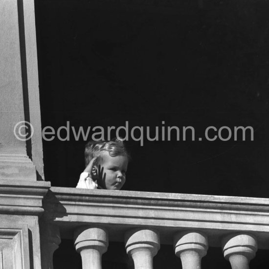 Prince Albert saluting at palace windows. Monegasque Fête Nationale, Monaco 1960. - Photo by Edward Quinn