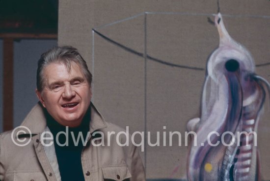 Francis Bacon with the painting "Carcass of Meat and Bird of Prey" at his Reece Mews studio in London 1980. - Photo by Edward Quinn