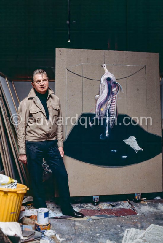 Francis Bacon with the painting "Carcass of Meat and Bird of Prey" at his Reece Mews studio in London 1980. - Photo by Edward Quinn