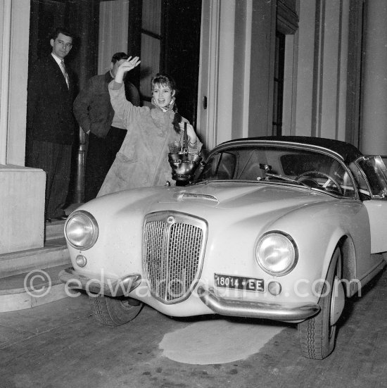 Many people think Brigitte Bardot owned a Lancia B24. It\'s absolutely not true. She loved Roger Vadim\'s car (her husband who used his car in the movie "Et Dieu créa la Femme") and commissioned a special bodied one took possession of it. Car: Lancia Aurelia B24 Spider America Cabriolet 1955. - Photo by Edward Quinn