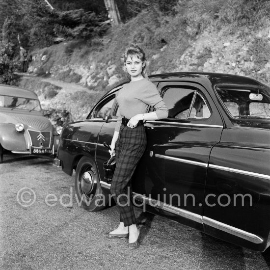 Two attractive stars, Brigitte Bardot and the Ford Vedette. Nice 1953. Cars: 1953 Ford Vedette. In the background 1951-54 Citroën 2CV type AU. - Photo by Edward Quinn