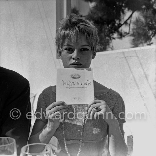 Brigitte Bardot with her signature. Cannes Film Festival 1956. - Photo by Edward Quinn