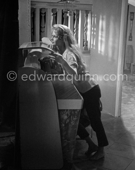 Brigitte Bardot at the juke box during filming of "Et Dieu créa la femme", Studios de la Victorine, Nice 1956. - Photo by Edward Quinn