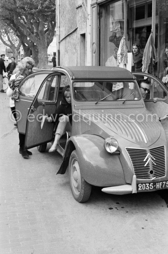 Brigitte Bardot with her friend and body double Maguy shopping in Saint-Tropez 1964. Car: Citroën 2CV. - Photo by Edward Quinn