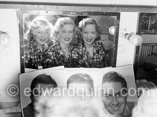 THE BEVERLEY SISTERS in her wardrobe, probably in a theatre in Soho, London 1950. They were the most popular, highest-earning female entertainers in the UK in the 1950s. - Photo by Edward Quinn