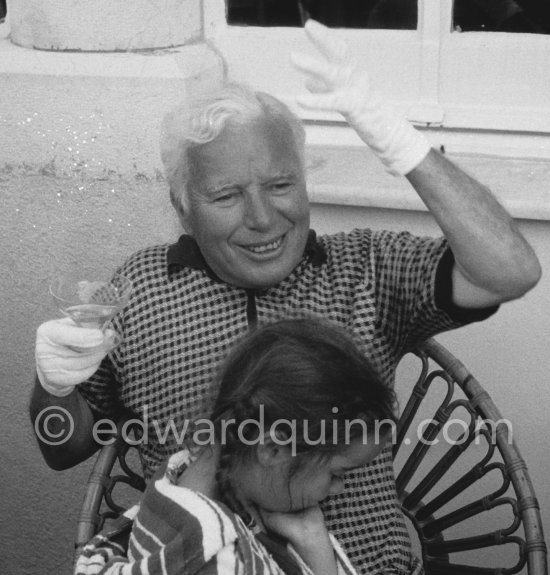 Charlie Chaplin with his daughter Josephine interviewed for a radio station. When asked why he was wearing white gloves, he said it wasn\'t coquetry, but a slight case of eczema. Villa Lo Scoglietto, Saint-Jean-Cap-Ferrat, 1956. - Photo by Edward Quinn