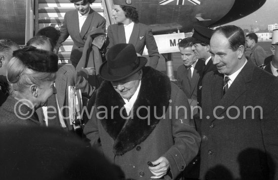 Sir Winston Churchill. On the right Edmond Murray, (Churchill’s Scotland Yard bodyguard). Arrival at Nice Airport 1961. - Photo by Edward Quinn