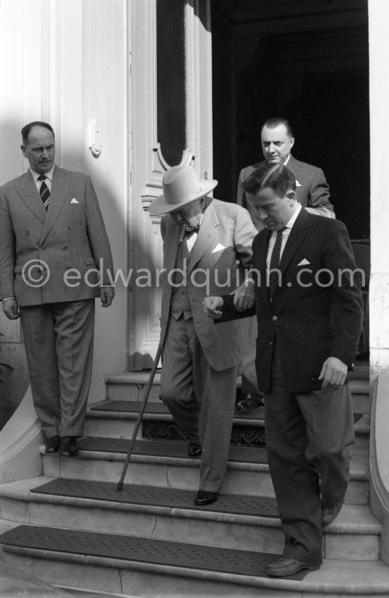 Winston Churchill. Edmond Murray, Sir Winston Churchill’s Scotland Yard bodyguard (left), Montague Brown, Churchill’s secretary (right). Polyclinique Princess Grace. Monaco 1962. - Photo by Edward Quinn