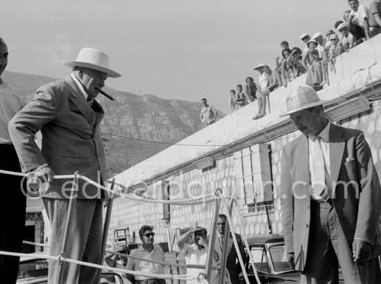 Onassis and Sir Winston Churchill leaving Onassis\' yacht Christina. Monaco harbor 1959 - Photo by Edward Quinn