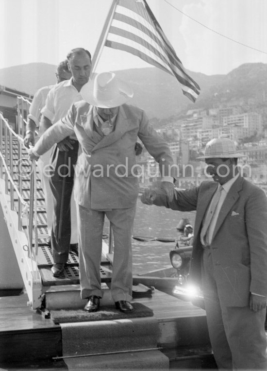 Onassis and Sir Winston Churchill leaving Onassis\' yacht Christina. Monaco harbor 1959 - Photo by Edward Quinn