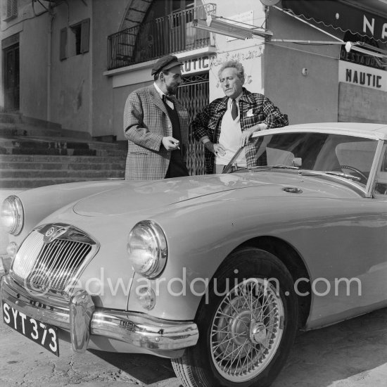 Jean Cocteau and a neighbour with his (?) MG A. Villefranche-sur-Mer 1956. - Photo by Edward Quinn