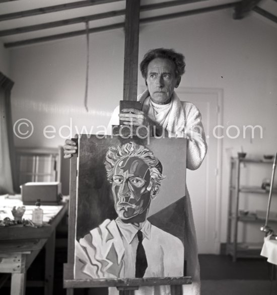 Jean Cocteau at Villa Santo Sospir posing with his "Autoportrait à la veste". Saint-Jean-Cap-Ferrat 1952. - Photo by Edward Quinn