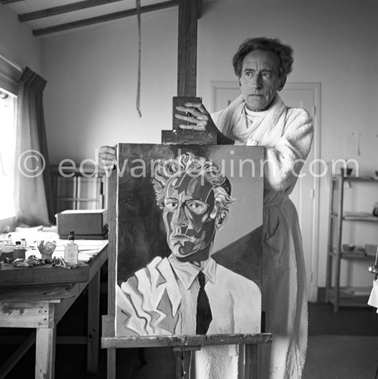 Jean Cocteau at Villa Santo Sospir posing with his "Autoportrait à la veste". Saint-Jean-Cap-Ferrat 1952. - Photo by Edward Quinn
