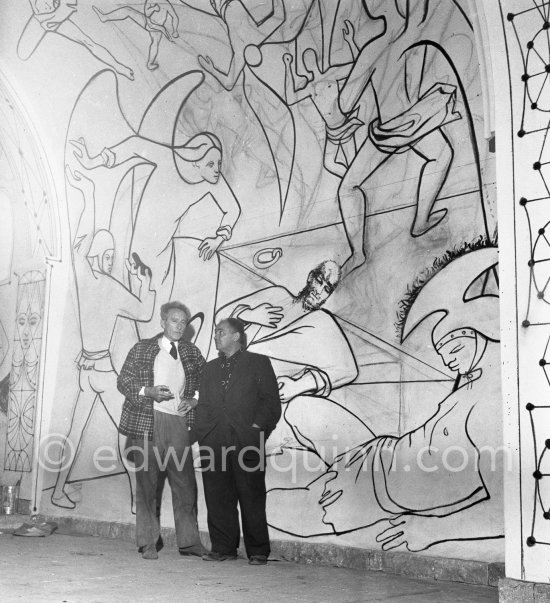 Jean Cocteau in front of the mural of the Chapelle Saint Pierre. Villefranche-sur-Mer 1956. - Photo by Edward Quinn