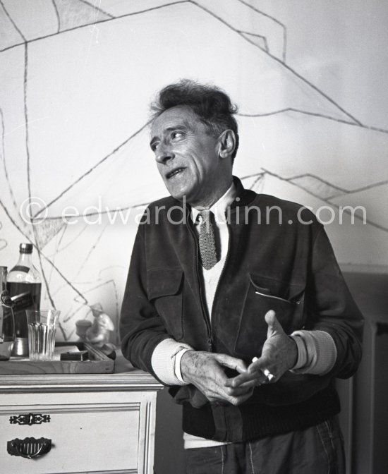 Jean Cocteau at Villa Santo Sospir of his close friend Francine Weisweiller in front of one of the murals he made for the interior walls. Saint-Jean-Cap-Ferrat 1954. - Photo by Edward Quinn