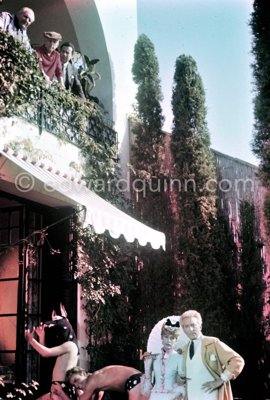 Jean Cocteau, Edouard Dermit, Francine Weisweiller during filming of "Le Testament d’Orphée", film of Jean Cocteau. On the balcony Alberto Magnelli, Pablo Picasso, Renato Guttuso. Saint-Jean-Cap-Ferrat 1959. - Photo by Edward Quinn
