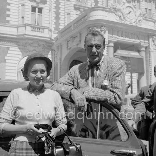 Gary Cooper and Olivia de Havilland in front of Carlton Hotel. Cannes 1953. - Photo by Edward Quinn