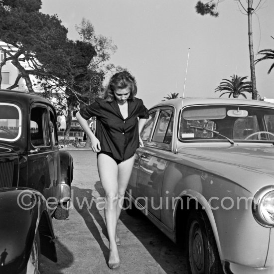 French actress Isabelle Corey during filming of "Et Dieu créa la femme" ("And God Created Woman"). Cannes Film Festival 1956. Cars: Peugeot 403, Citroën - Photo by Edward Quinn