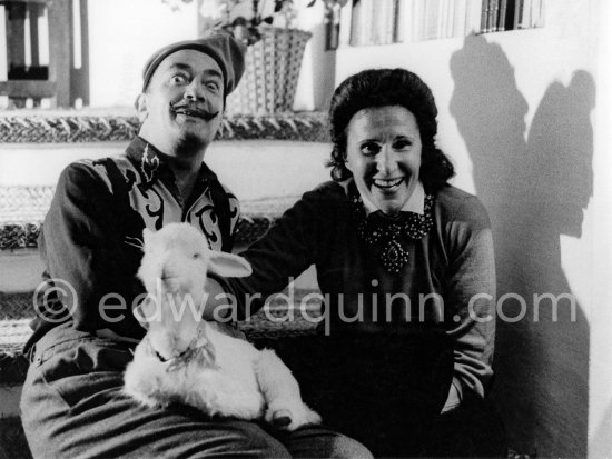 Salvador Dalí posing with a stuffed toy lamb and his Russian-born wife Gala. Salvador Dalí was known to submit all his work for Gala’s approval. At Salvador Dalí’s house, Portlligat, Cadaqués, 1957. - Photo by Edward Quinn