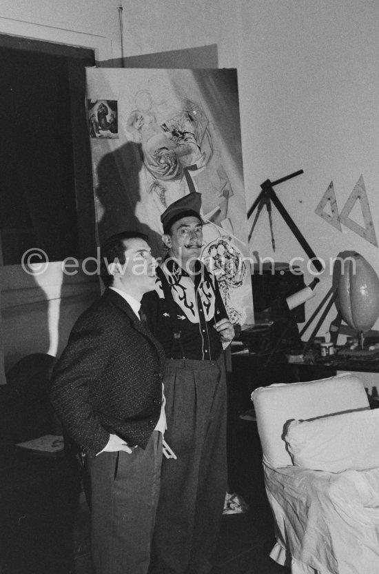 Salvador Dalí and French painter Raymond Moretti. At Dalí\'s house, Portlligat, Cadaqués, 1957. - Photo by Edward Quinn