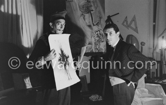 Salvador Dalí and French painter Raymond Moretti. At Dalí\'s house, Portlligat, Cadaqués, 1957. - Photo by Edward Quinn