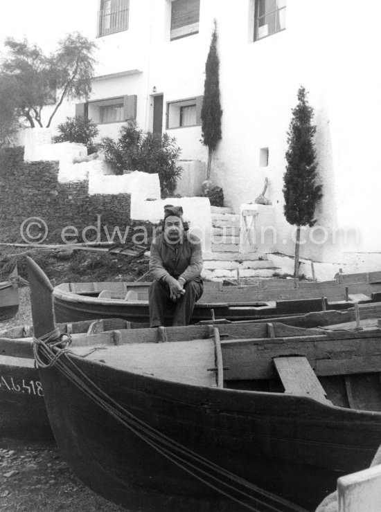 Salvador Dalí sits in front of his home in a little fishing port Portlligat, Cadaqués, on the Costa Brava in Spain. 1957. - Photo by Edward Quinn