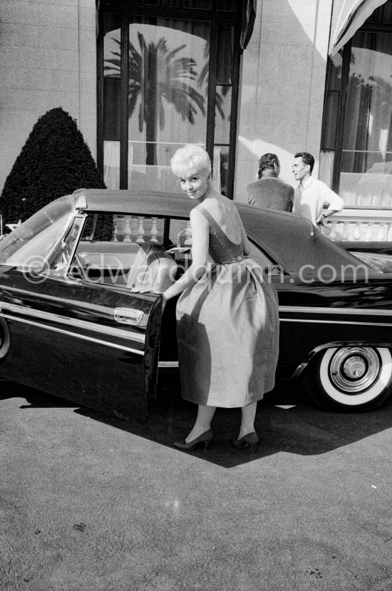 Mylène Demongeot. Cannes 1957. Car: Chrysler New Yorker 1957 Sport Convertible - Photo by Edward Quinn