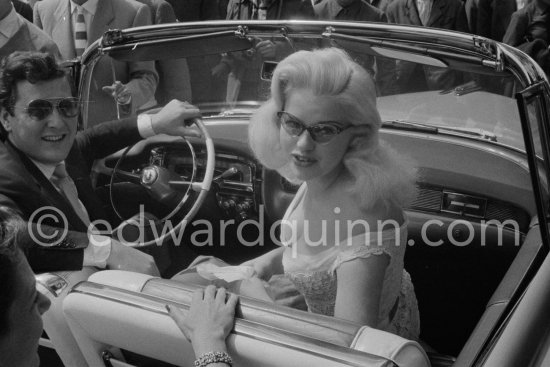 Diana Dors and husband Dennis Hamilton. Cannes Film Festival 1956. Car: Cadillac 1955 Series 62, Style 6267x Convertible - Photo by Edward Quinn