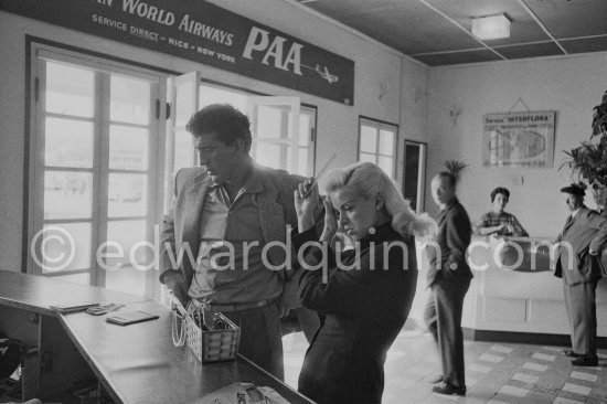 Diana Dors and Tommy Yeardye, stuntman, her boyfriend, arriving at Nice Airport 1957. - Photo by Edward Quinn