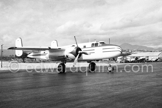 The private plane of Porfirio Rubirosa, a converted North American B-25 Mitchell, at Cannes Airport in 1954. North American B-25 Mitchell B-25H-1NA 43-4432 (N10V). See https://bit.ly/2XS08rs. Was as "Berlin Express" in the 1970 movie Catch-22. Today at Eagle Hangar, EAA Aviation Museum, Oshkosh. - Photo by Edward Quinn