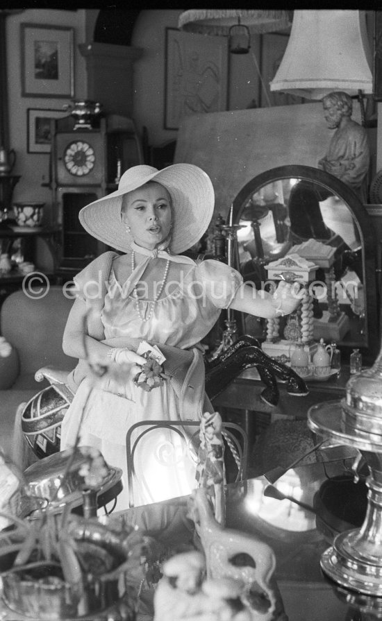 Zsa Zsa Gabor, in an antique dealer\'s shop, Antibes 1959. - Photo by Edward Quinn