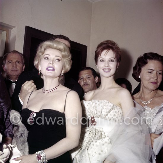 Zsa Zsa Gabor and a not yet identified lady attend a gala evening. On the left her current boyfriend, construction industry manager Hal Hays. Cannes Film Festival 1959. - Photo by Edward Quinn