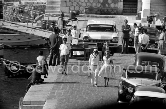 Swedish actress Greta Garbo (left) with Tina Onassis leaving the yacht Christina in Monaco 1958. Cars: 1957 Mercury Station Wagon, 1955 Ford Thunderbird convertible hardtop of Onassis, Bentley R Park Ward Drophead Coupé 1953 ? - Photo by Edward Quinn