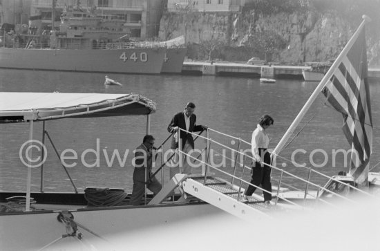 Greta Garbo, American businessman boyfriend George Schlee and Aristotle Onassis leaving the yacht Christina. Monaco 1955. - Photo by Edward Quinn