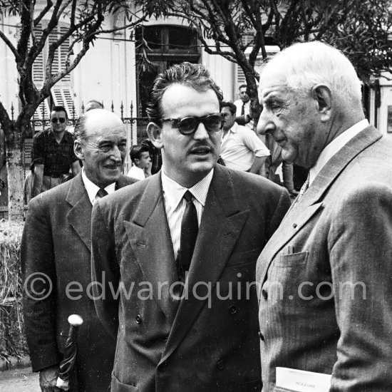 Prince Rainier and Charles Faroux, Clerk of the Course since the first edition. Behind Rainier with the flag founder of the race Antony Noghes. Monaco Grand Prix 1950. - Photo by Edward Quinn