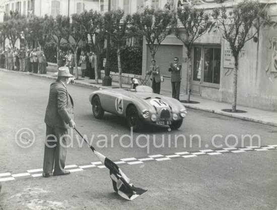 Robert Manzon, (14) winner of the race, Gordini T15S. With the flag Charles Faroux, Clerk of the Course since the first edition . Monaco Grand Prix 1952, transformed into a race for sports cars. This was a two day event, the Sunday for the up to 2 litres (Prix de Monte Carlo), the Monday for the bigger engines, (Monaco Grand Prix). - Photo by Edward Quinn