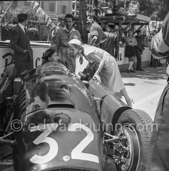 During filming of "The Racers" on the occasion of Monaco Grand Prix 1955: Bella Darvi, Polish French actress, supposed to be a flirt of Prince Rainier, with a mechanic. Lancia D50 of Louis Chiron. Monaco 1955. Monaco Grand Prix 1955. - Photo by Edward Quinn