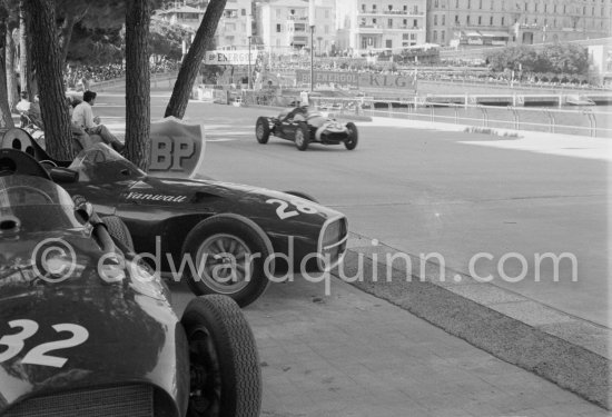 Stranded Vanwalls of Stirling Moss\' (28) and Stuart Lewis-Evans\' (32). Maurice Trintignant, (20), Cooper T45 (winner) passes. Monaco Grand Prix 1958. - Photo by Edward Quinn