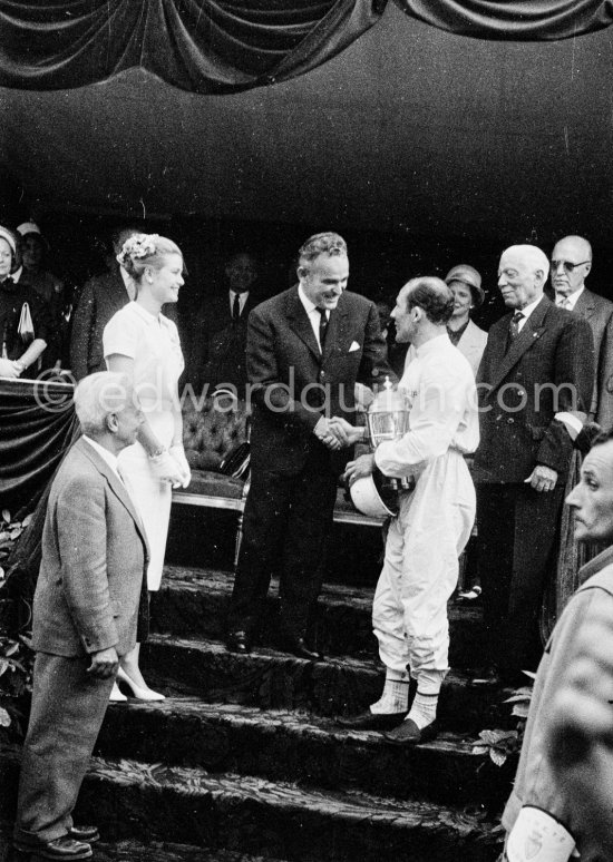 Winner of the race Stirling Moss at the Prince\'s tribune for the prize-giving by Princess Grace and Prince Rainier. Monaco Grand Prix 1960. - Photo by Edward Quinn