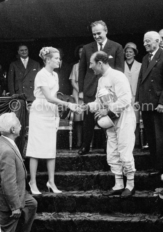 Winner of the race Stirling Moss at the Prince\'s tribune for the prize-giving by Princess Grace and Prince Rainier. Monaco Grand Prix 1960. - Photo by Edward Quinn