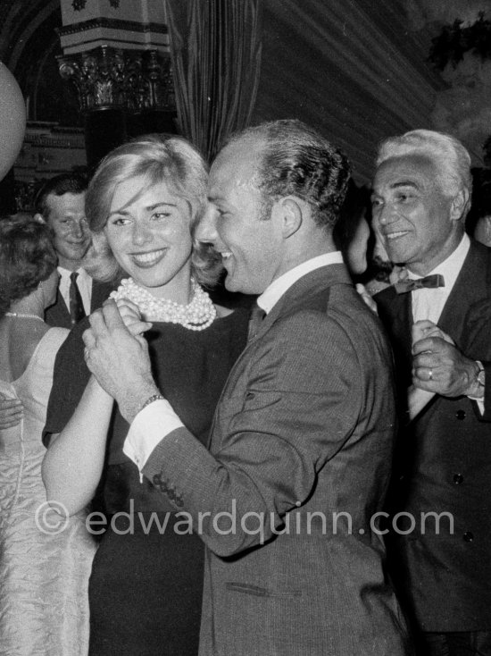 Stirling Moss, winner of the Grand Prix, gets into the party spirit as he dances with Swedish model Helga Mayerhoffer. Piero Taruffi on the right Gala of Monaco Grand Prix 1960. - Photo by Edward Quinn