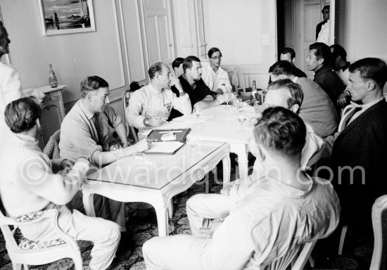 Stirling Moss as chairman addresses the inaugural meeting of a new racing drivers association (Grand Prix Drivers’ Association) in room 183 of Monte Carlo\'s hotel Metropole. On his left vice chairman Joakim Bonner and Masten Gregory, on his right the association\'s secretary Peter Garnier. In foreground left Innes Ireland and right back to camera John Surtees. Back right Maurice Trintignant, Olivier Gendebien, Dan Gurney and Henry Taylor. oMonaco Grand Prix 1961. - Photo by Edward Quinn