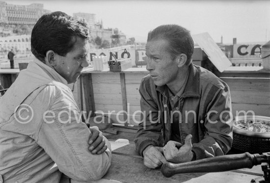 Richie Ginther and not yet identified person. Monaco Grand Prix 1961. - Photo by Edward Quinn
