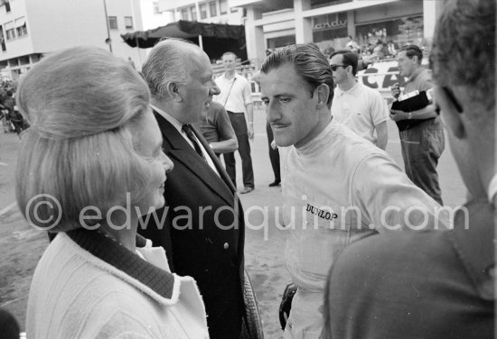 Graham Hill, Louis Stanley "Big Lou", B.R.M. chairman, and his wife. Monaco Grand Prix 1965. - Photo by Edward Quinn