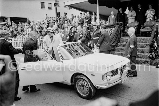 Princess Grace, Prince Bernhard of the Netherlands and Prince Rainier (behind Bernhard) arriving for the Monaco Grand Prix 1965. Far left Louis Chiron, race director. Car: Alfa Romeo Giulia GTC Cabriolet. - Photo by Edward Quinn
